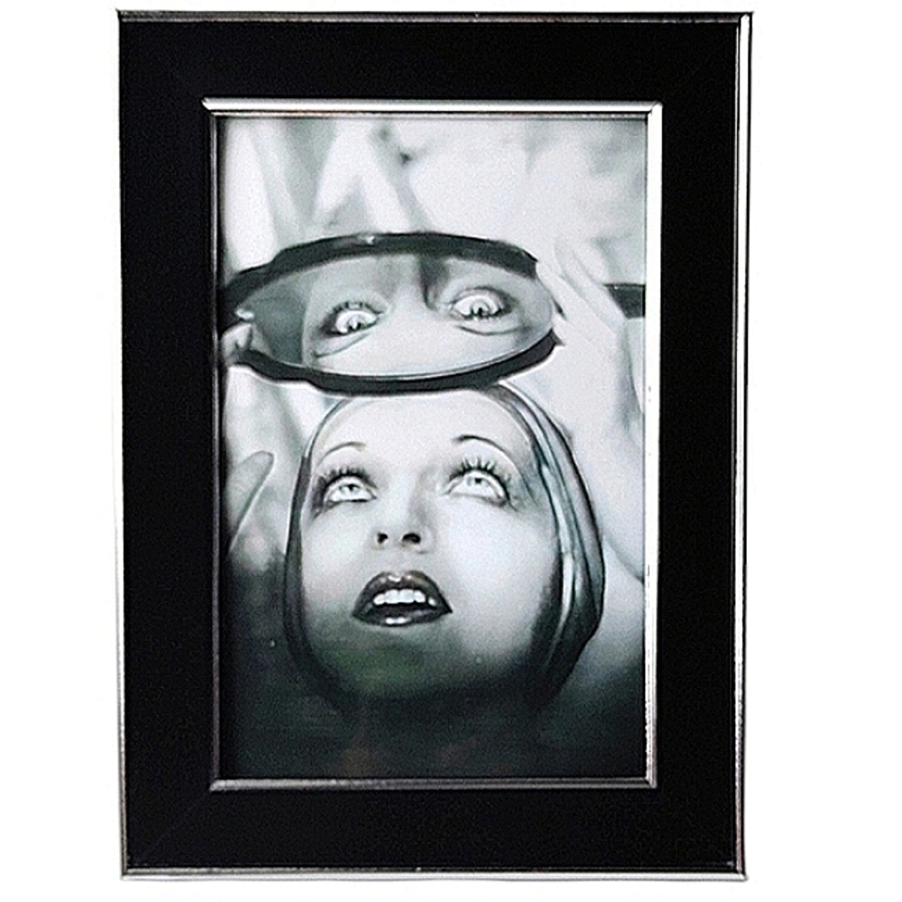 Vintage Beauty Woman getting her eyebrows waxed looking in mirror framing photo